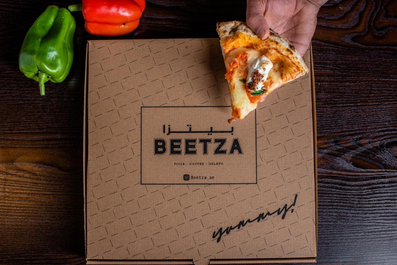 Officers Club & Hotel Abu Dhabi Esterno foto Beetza pizza